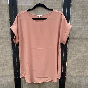 Short sleeve, round neck, tunic length blouse.